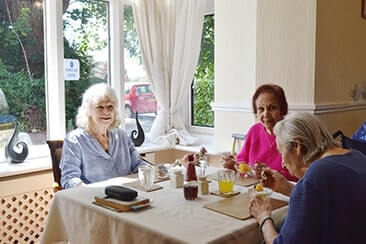 Residents at lunch in the dining room at Fairholme House