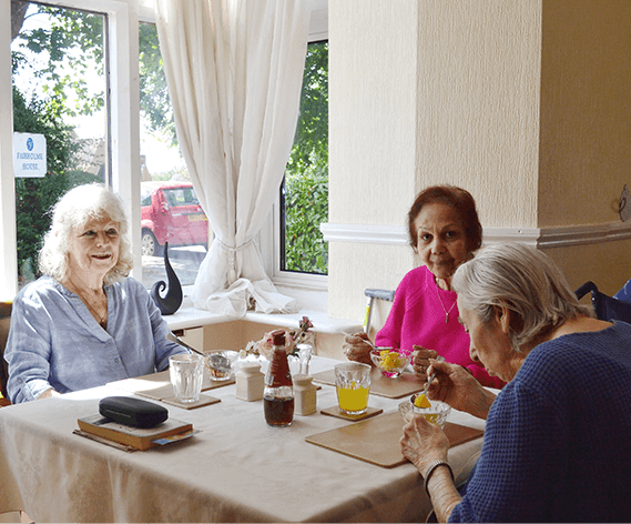 Residents at lunch in the dining room at Fairholme House