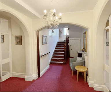 The entrance hall and staircase at Fairholme House